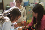 kids painting medusa mask